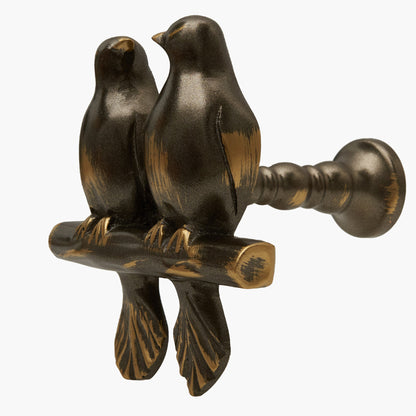 Wall mounted curtain tie back two birds on a branch. Designed as two large birds on a branch looking each other.