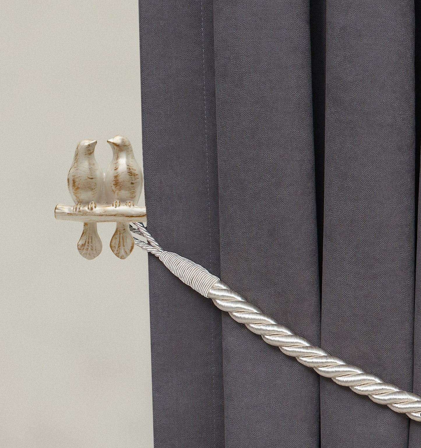 Wall mounted curtain tie back two birds on a branch. Designed as two large birds on a branch looking each other.